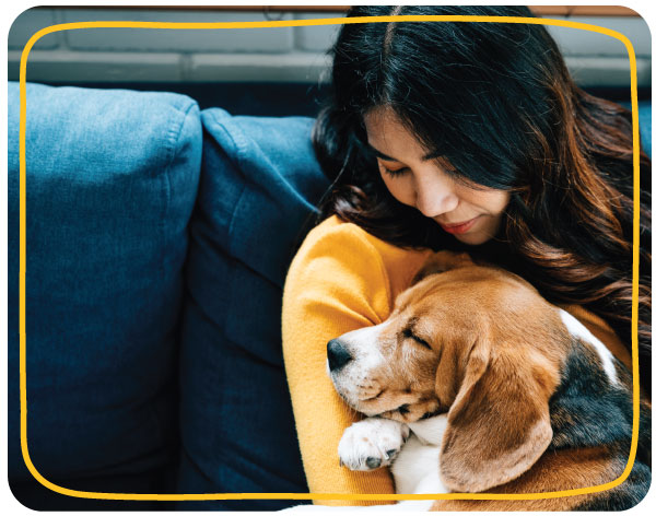 The Pet-Parent Bond Pet parent cuddling a puppy at home, reflecting the emotional bond and trust that shape pet-parent decision making.